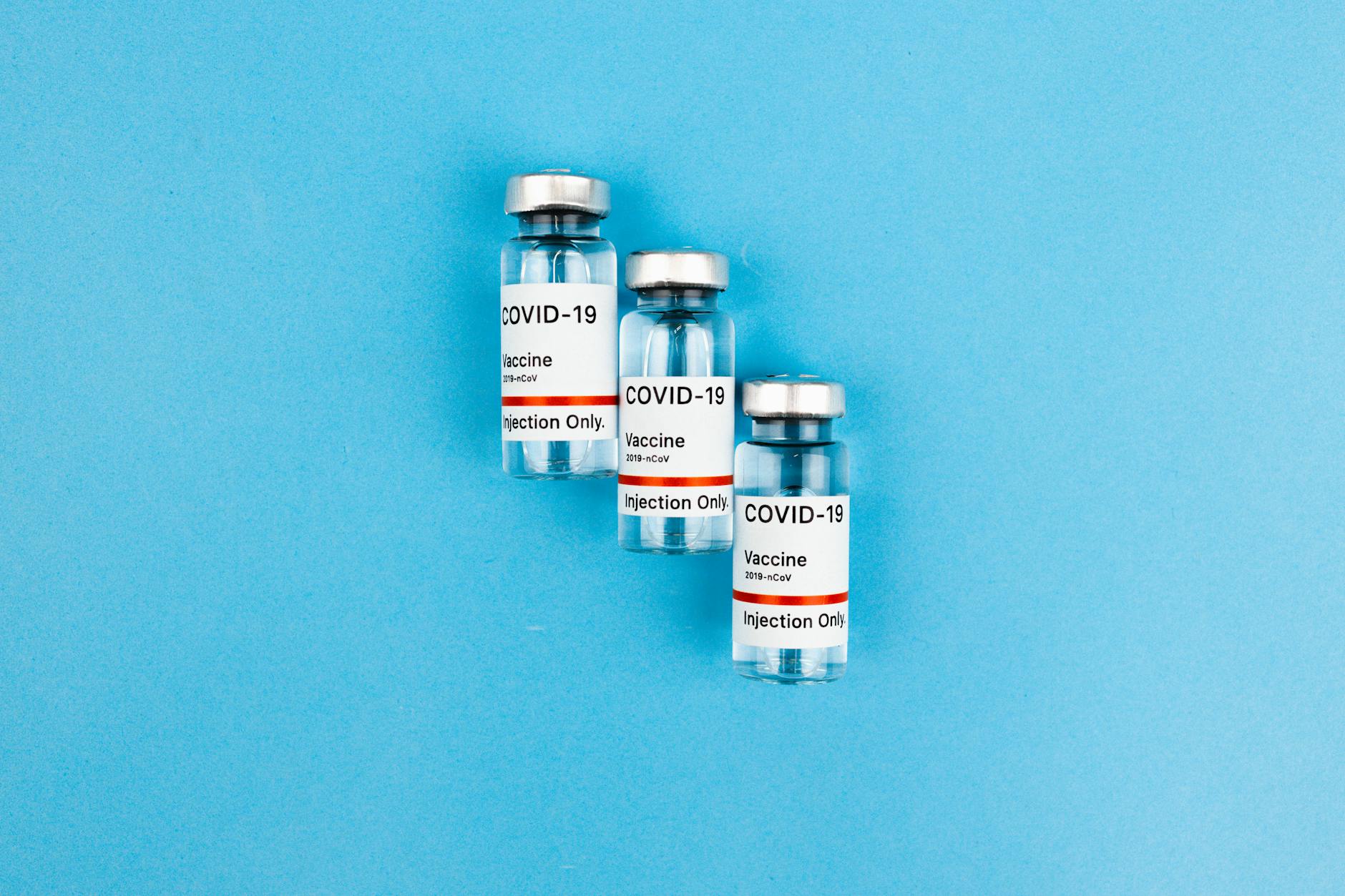 https://www.pexels.com/photo/vaccine-bottles-on-blue-background-5994665/