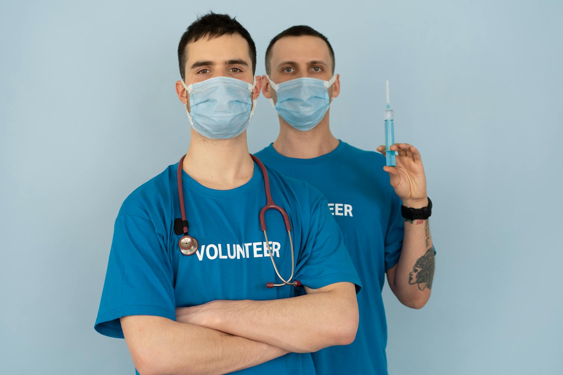 https://www.pexels.com/photo/man-in-blue-crew-neck-t-shirt-with-white-face-mask-7475385/